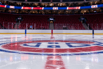 Montreal Canadiens logo at centre ice inside the Bell Centre ahead of an NHL game.